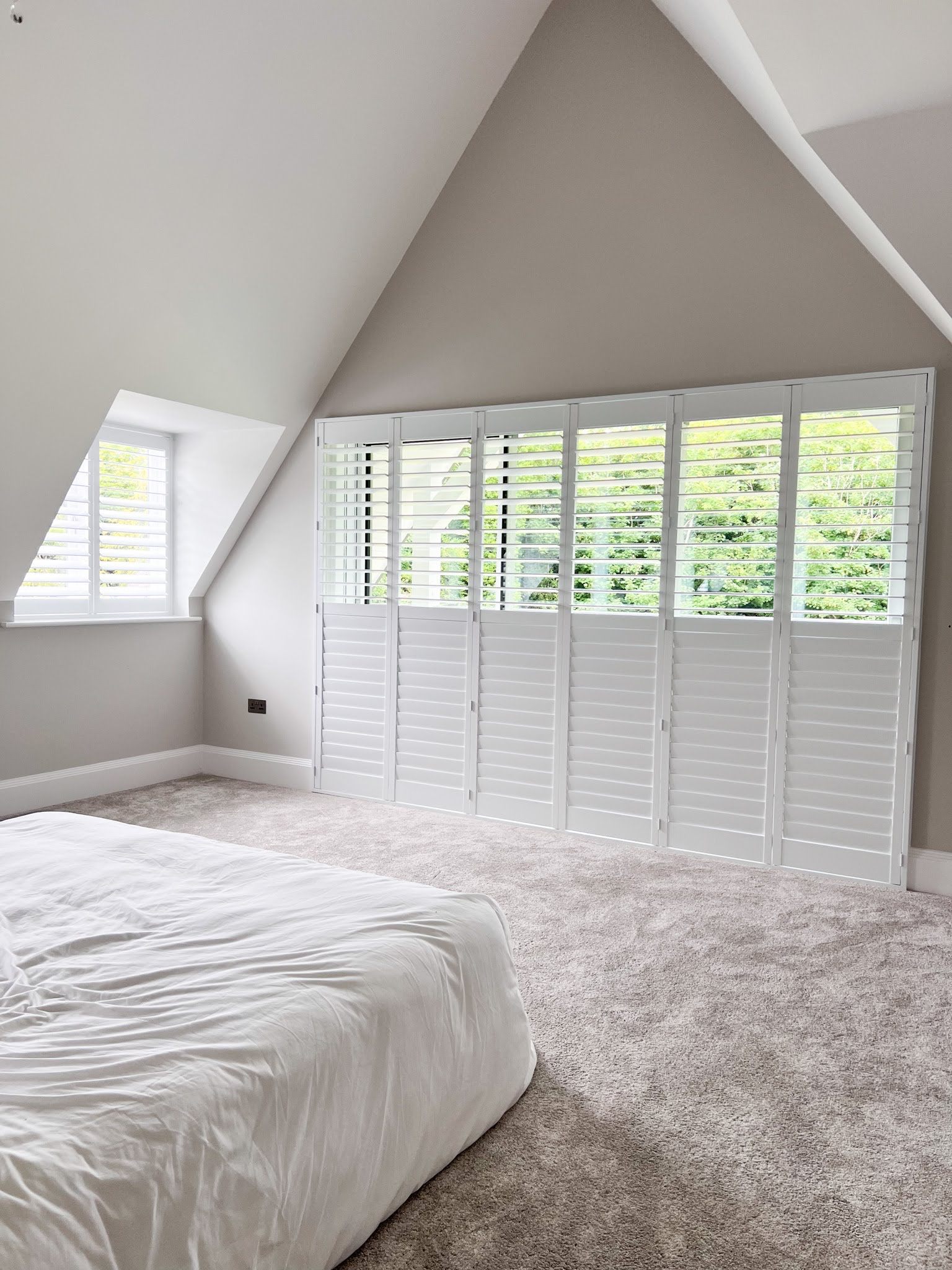 Full height plantation shutters in an elegant room